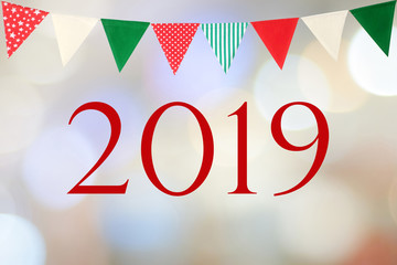 Happy new year 2019 and party bunting flags over blur bokeh background, new year greeting card