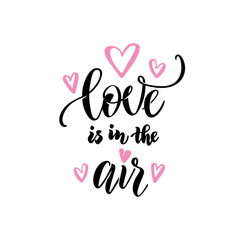 Love couple, wedding, valentines day concept. Love is in the air hand lettering calligraphy text isolated. Greeting card