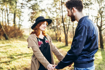 Happy young romantic couple spend time together outdoor.