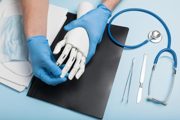 Prosthetics hands at doctor in clinic. Artificial limb.