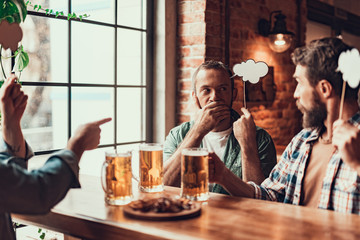 Friends with beer and thought bubbles spending time at pub