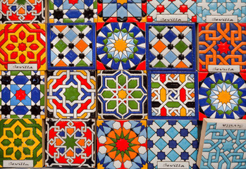 Colorful souvenir magnets for tourists with traditional arabic and spanish patterns, symbols of Andalusia