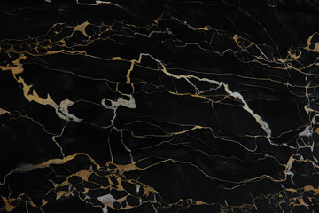 Yellow veins on black polished natural marble Nero Portoro