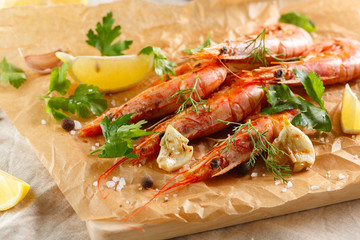 Grilled shrimps with spice, garlic and lemon. Grilled seafood. top view