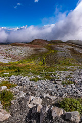 rocky mountain trail high up in the clouds