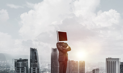 Businessman with monitor instead of head.