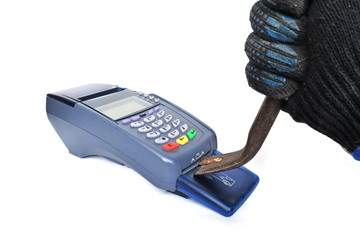 Man hand in a dirty black work glove hacks Pos payment terminal with a Claw hammer on white...