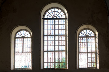 wrought iron bars on the windows in the old church