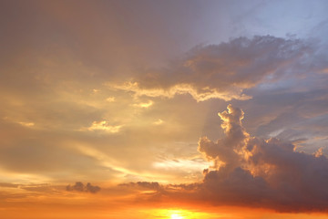 Beautiful silhouette picture of sunset above the sea, Warm orange sky with sunset light shine through clouds, Sunset sky with copy space for your text, Sunset sky on the coastline, Sunrise sky on sea