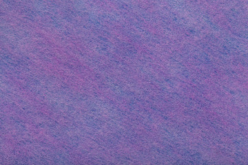Dark purple and violet background of felt fabric. Texture of woolen textile