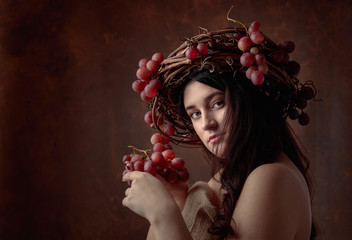 Beautiful girl with grapes.