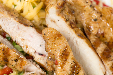 Delicious salad with cheese and chicken fillet.