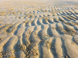 The patterns on the sand after the water down.