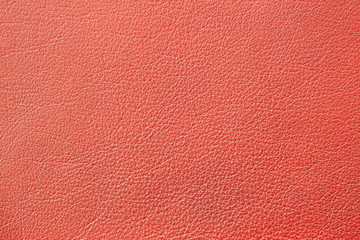 Texture of genuine leather, orange color, background, surface. For your backdrop, with copy space