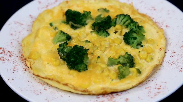 Breakfast. Omelet with broccoli and corn. Tasty breakfast