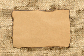 Burned Notebook Sheet over Jute Background    
