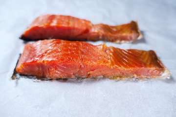 sliced smoked red fish. white background