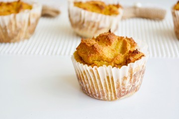 Tasty pumpkin spice cupcakes on the white table