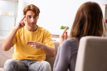 Woman and man learning sign language
