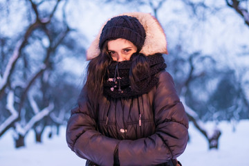 Fototapeta na wymiar young female frost girl feeling cold outdoors on a winter season f