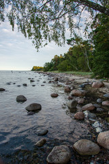 blue sky white clouds over calm body of water