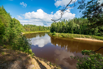 Obraz premium blue sky white clouds over calm body of water