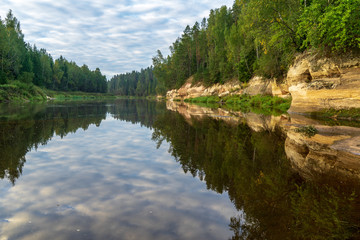 sandstone cliffs with tourist trail on river of gauja, Latvia