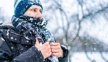 close up frost man's face with scarf covered by snow on a winter day f