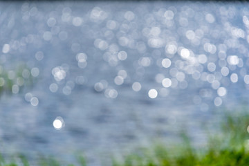 Obraz premium lakeside beach details with sand, rocks and blur background