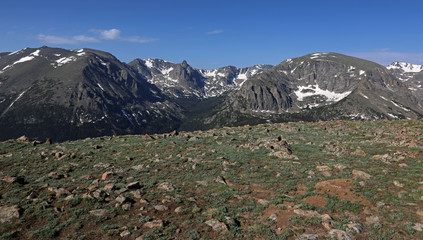 Fototapeta na wymiar The tundra just off of the Trail Ridge Road in Rocky Mountain National Park, Colorado. The mountain peaks in the background from left to right are, Stones Peak, Sprague...