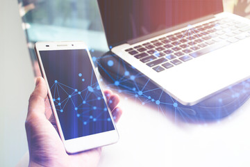 business man pick hold mobile phone and hologram web with nptebook laptop computer with network technology