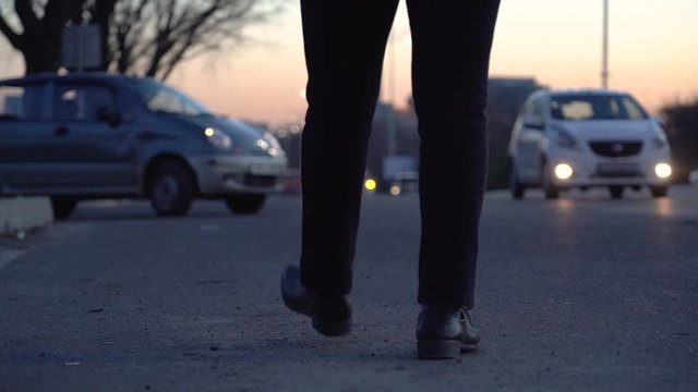 Night road in the city, a man came to catch a taxi, a man goes against the traffic