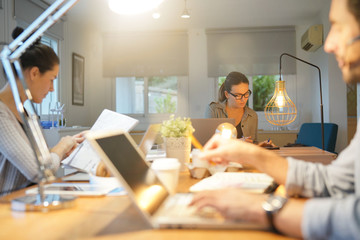 Three colleagues in co working space