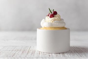 Pavlova Cake with berry cranberries on white background