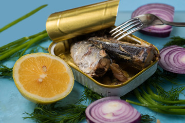 Open tin with sardines.