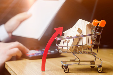 The concept of real estate market growth. The increase in housing prices. Rising prices for...