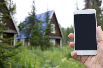 smart phone against the background of houses