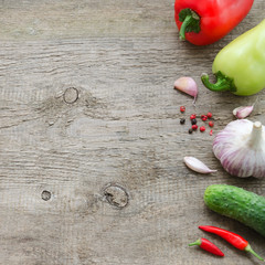 Frame of vegetables: cucumber, tomato, pepper, onion, garlic