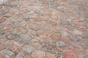 Unique view of old, brick road on an old street.
