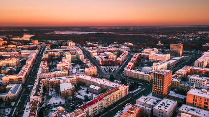 Fototapeta na wymiar Beautiful sunset on the background of a European city with a copter. Gomel. Belarus.