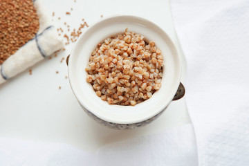 Soaked buckwheat in a clay pot, top view