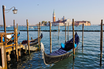 Fototapeta na wymiar Gondola docked in Grand Canal Venice (Venezia)