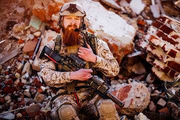 rangers with assault rifles on battlefield background. army, military and people concep