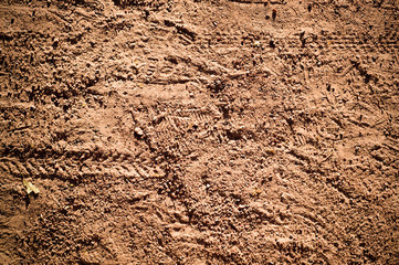 sandy path with cycle bike tire tracks with vignette. background, texture