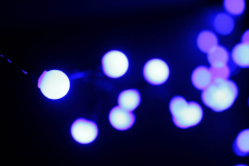 abstract lights background. garland on the wooden background