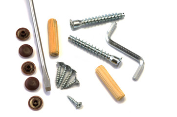Nails and screws on a white background.