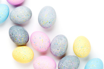Background with pale pink, blue, yellow and gray Easter eggs. Compositions in pastel colors.  Easter concept