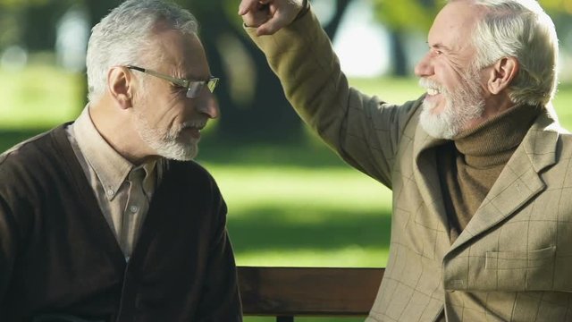 Funny Old Men Playing Rock-paper-scissors Game, Flicking Forehead, Having Fun