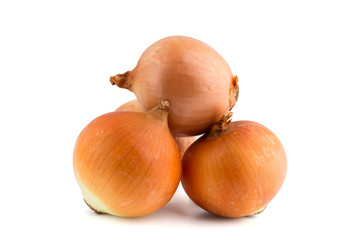 Several onions on a white background. Unpeeled fresh onions close up on a white background.