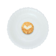 Cheesecake with heart on a white plate. Isolated. Breakfast for the beloved.